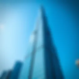 Stunning view of the Dubai World Trade Center Tower against a clear blue sky