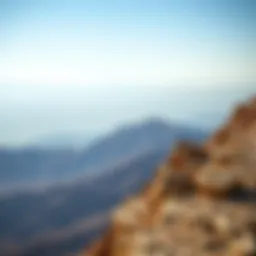 Spectacular view from the summit of Jebel Jais showcasing rugged terrain and distant horizons
