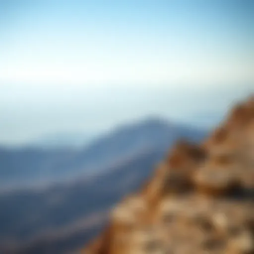 Spectacular view from the summit of Jebel Jais showcasing rugged terrain and distant horizons