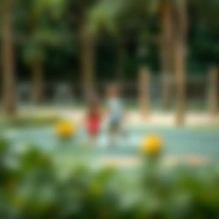 Children playing in the designated play area amidst nature in Mushrif Park
